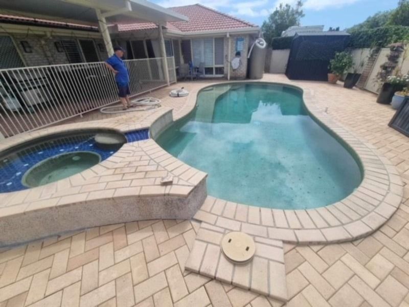 Backyard With a Large Swimming Pool and SPA — Mad Pool Interiors and Renovations in Baringa, QLD