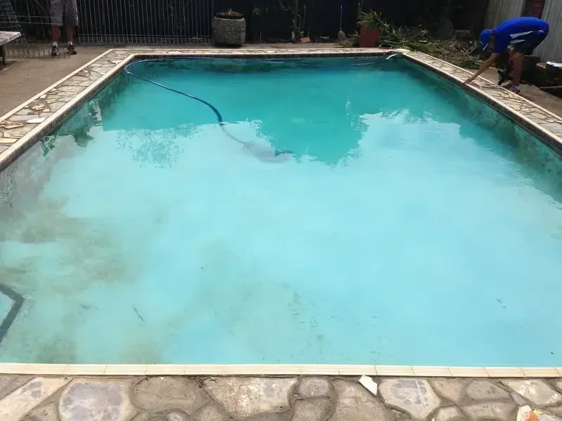 A Cloudy Backyard Swimming Pool — Mad Pool Interiors and Renovations in Baringa, QLD