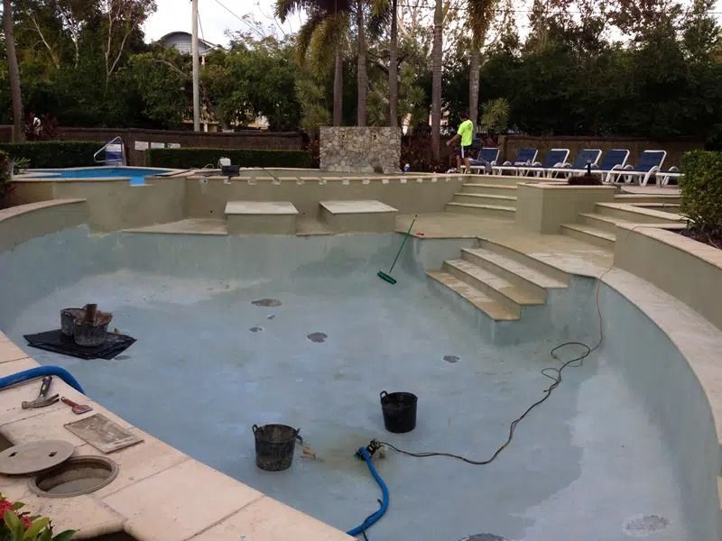 Empty Drained Swimming Pool Being Repaired — Mad Pool Interiors and Renovations in Baringa, QLD
