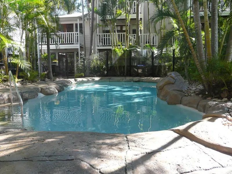 Tropical Resort Pool With Turquoise Water — Mad Pool Interiors and Renovations in Baringa, QLD