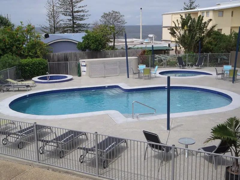 Outdoor Pool With a Central Swimming Area — Mad Pool Interiors and Renovations in Baringa, QLD