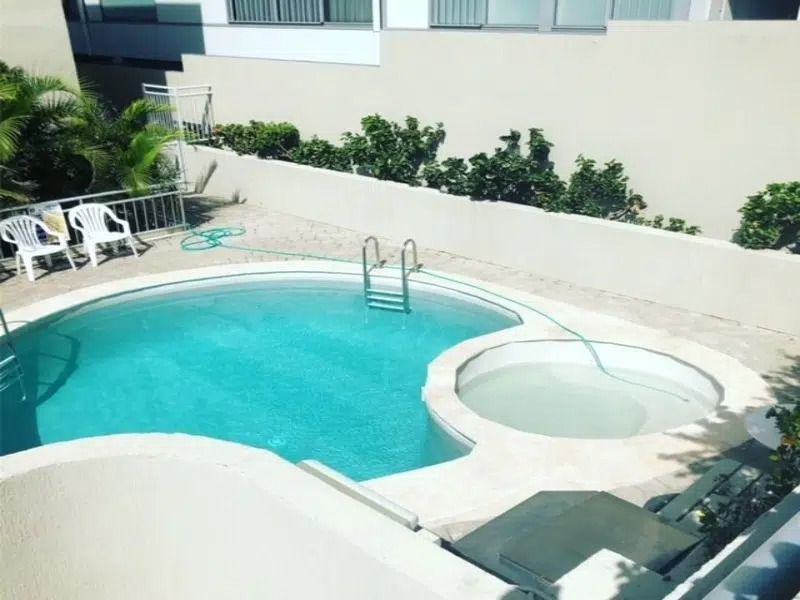 Small Outdoor Pool With Hot Tub — Mad Pool Interiors and Renovations in Baringa, QLD