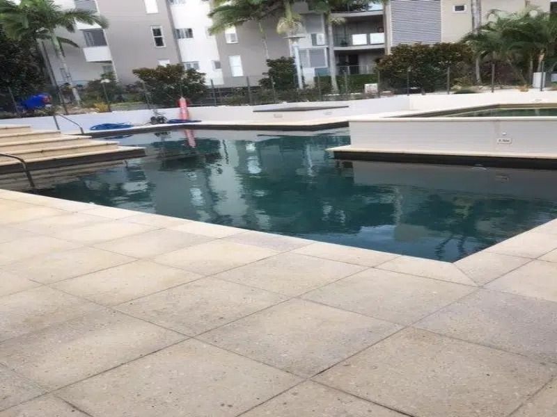 Apartment Courtyard Pool With Dark Water — Mad Pool Interiors and Renovations in Baringa, QLD