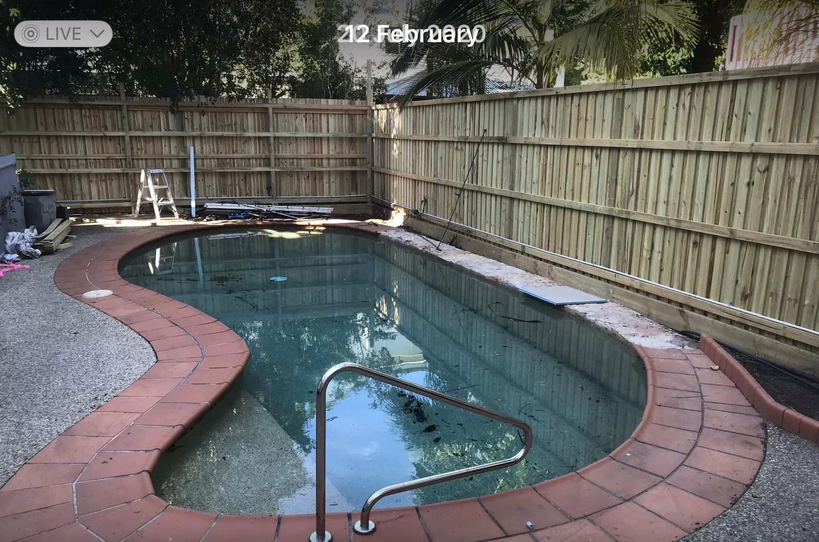 Curved Backyard Swimming Pool With Brick Coping — Mad Pool Interiors and Renovations in Baringa, QLD