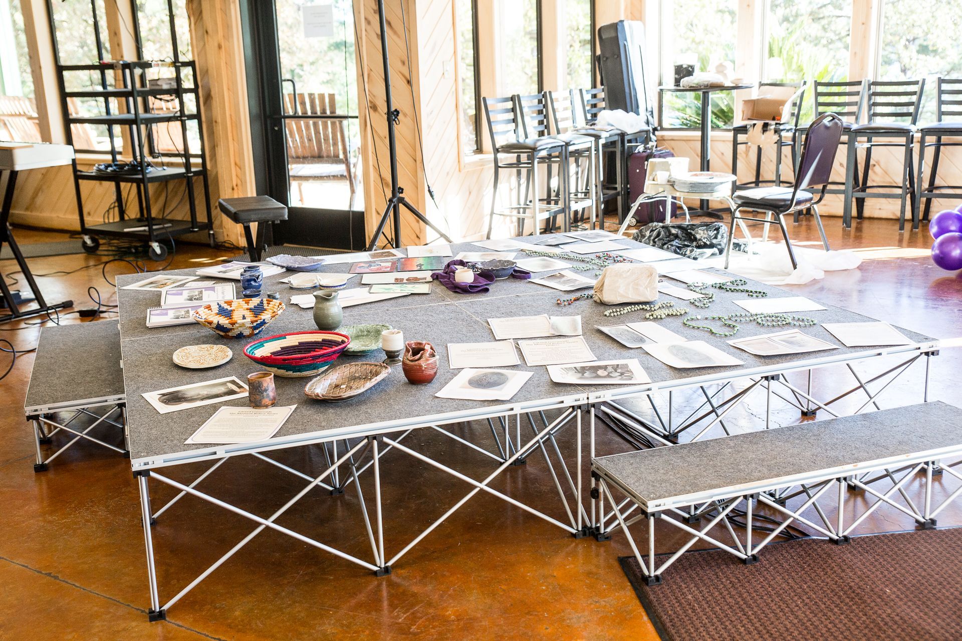 A table with a lot of papers on it in a room.