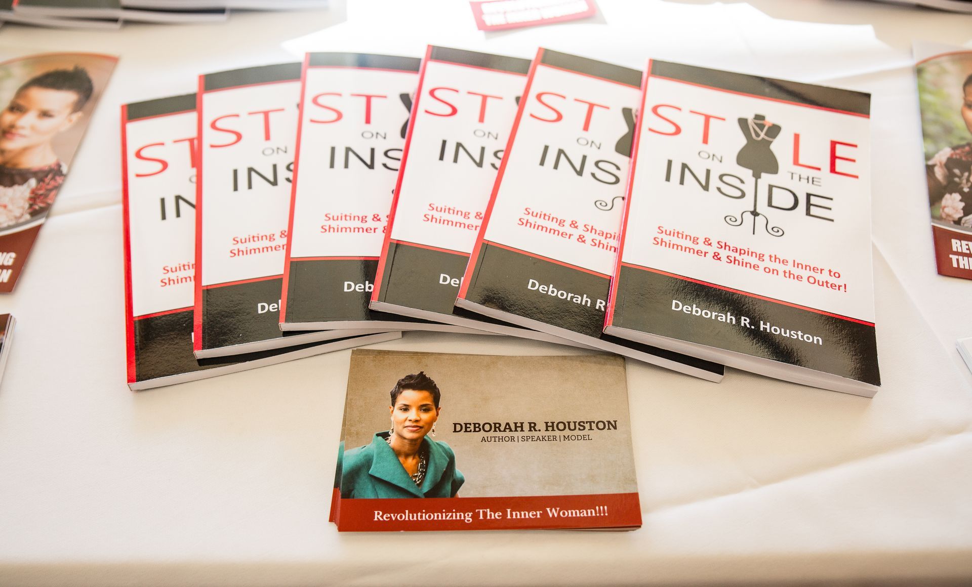 A stack of books titled ' style inside ' on a table