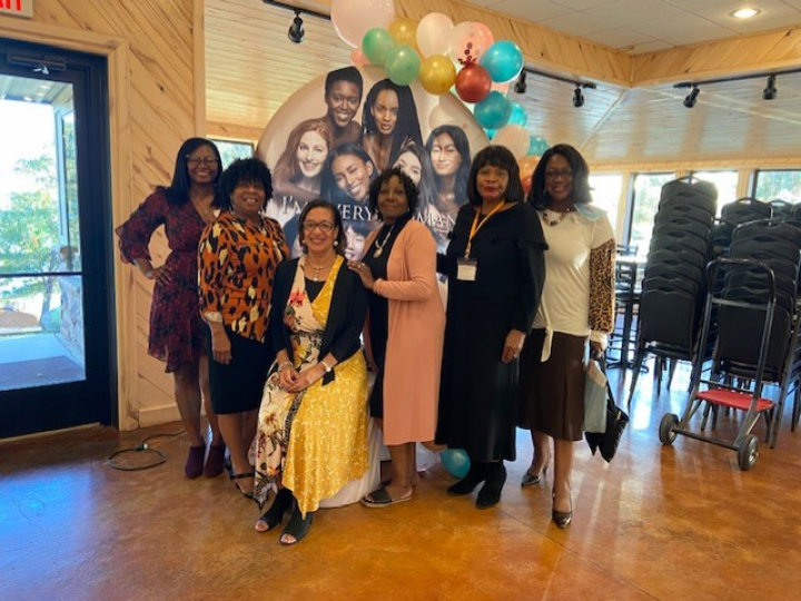 MC Sheran Frazier-West, Speaker Annetta Whetstone, Moderator Lesia Lewis, Mae Chism, Natash White, and Linda Rhymes