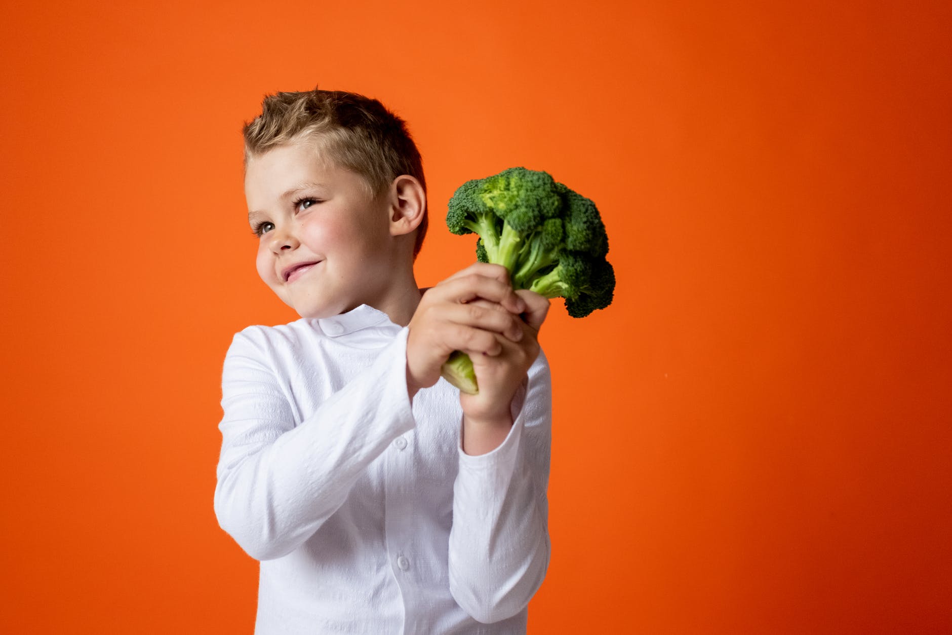 Picture of boy holding vegetable