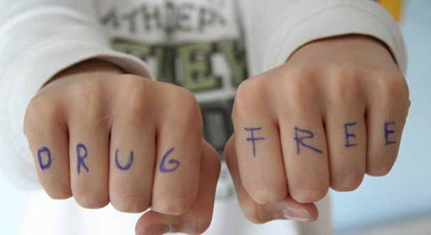 two fist with drug free text