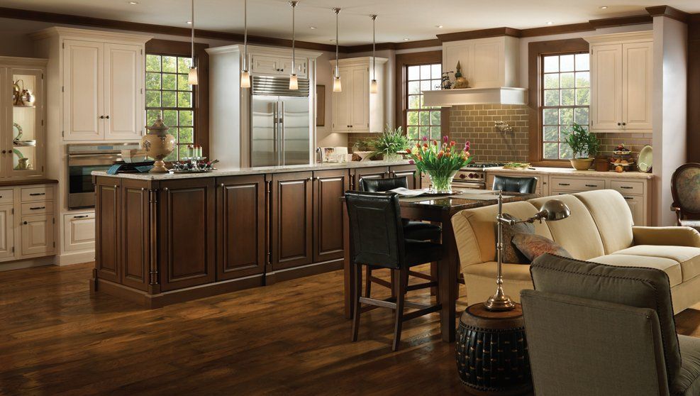 A kitchen with a dining table and chairs and a couch