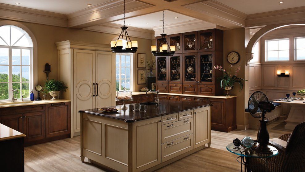 There is a large island in the middle of the kitchen.