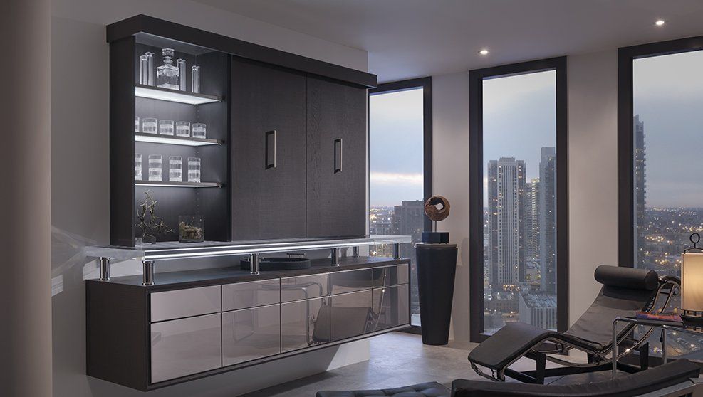 A living room with a lot of windows and a couch.