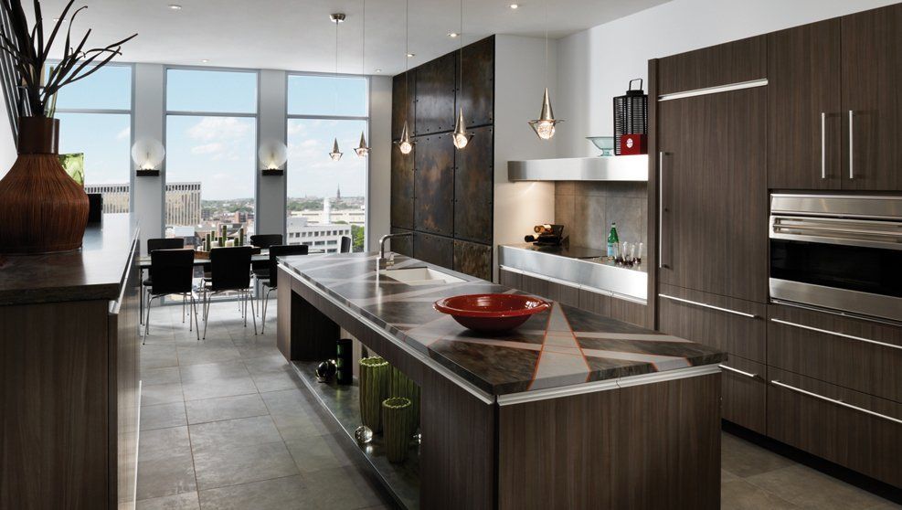 A kitchen with stainless steel appliances and a large island