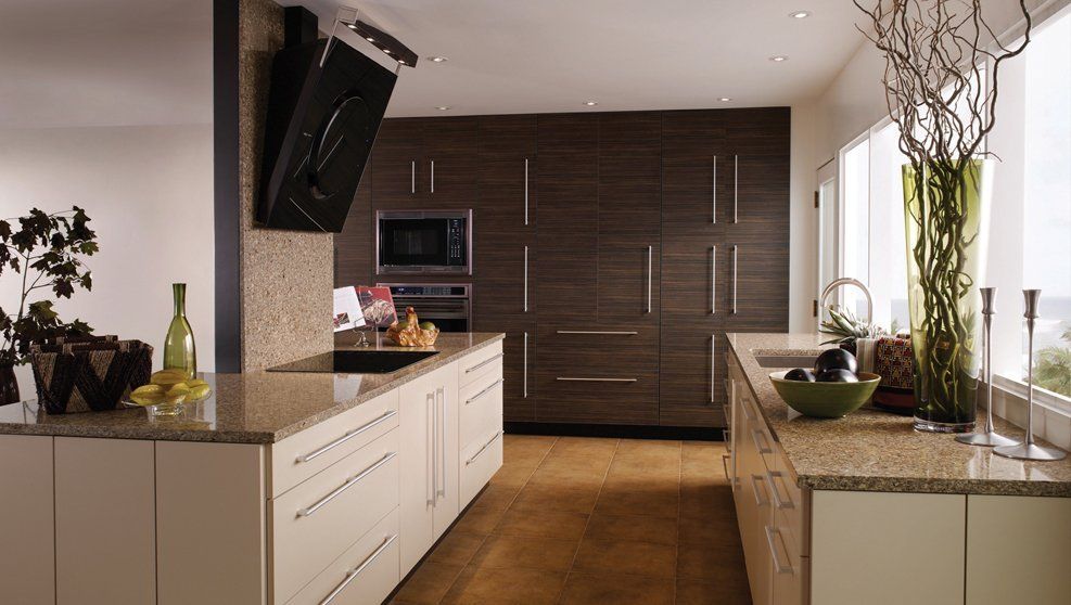 A kitchen with wooden cabinets and granite counter tops