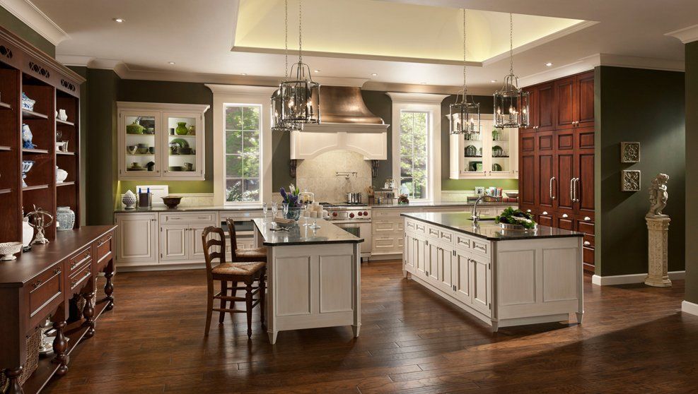 A large kitchen with a large island in the middle.