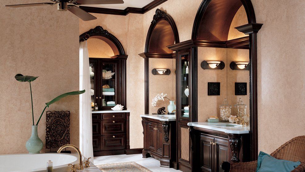 A bathroom with two sinks and a ceiling fan