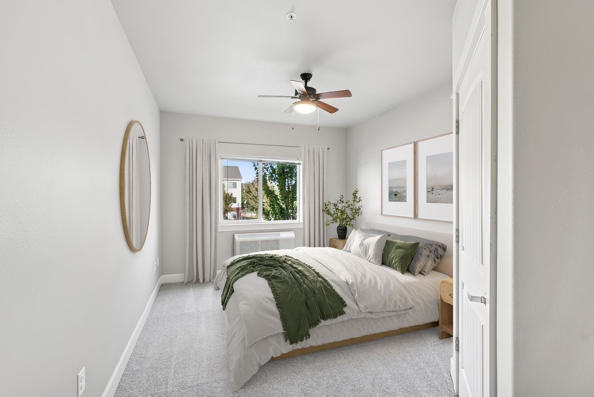 Bedroom with bed, art, window, and ceiling fan; soft gray and white tones.