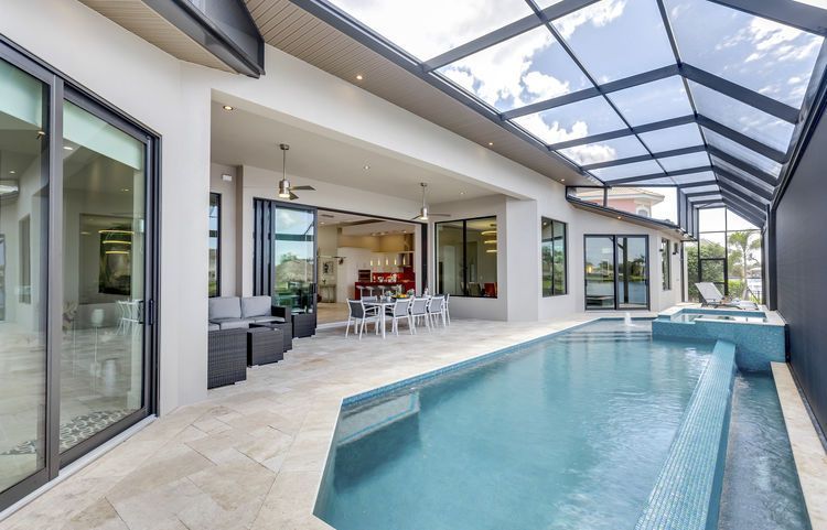 There is a large swimming pool in the middle of the house.