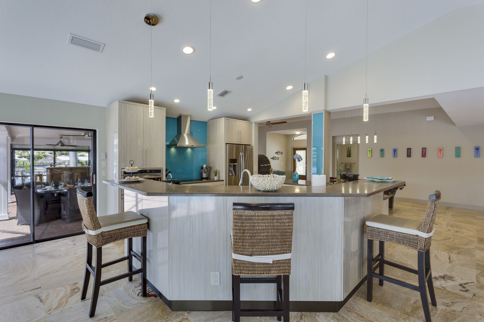 A kitchen with a large island and stools
