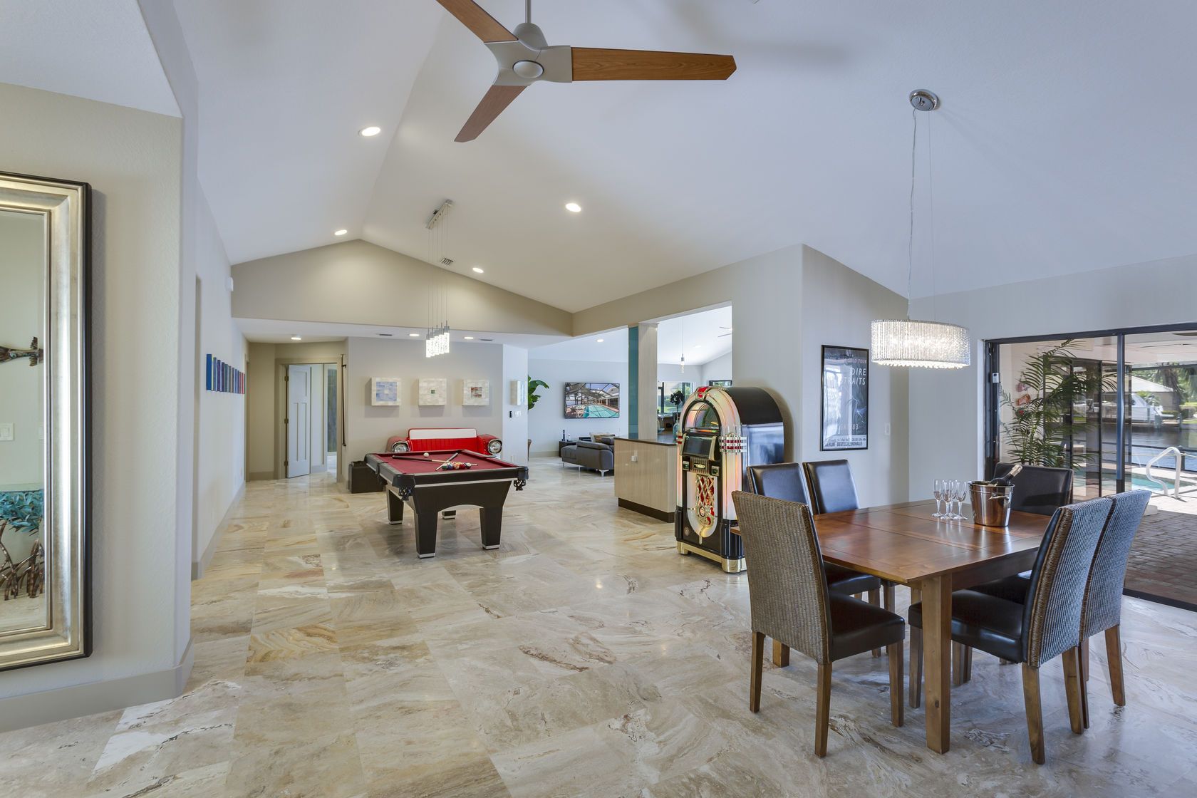 There is a pool table in the middle of the room.