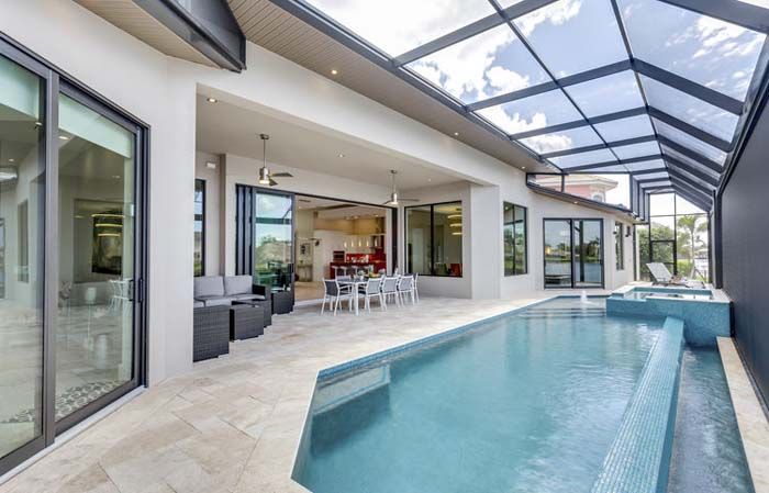 There is a large swimming pool in the middle of the house.