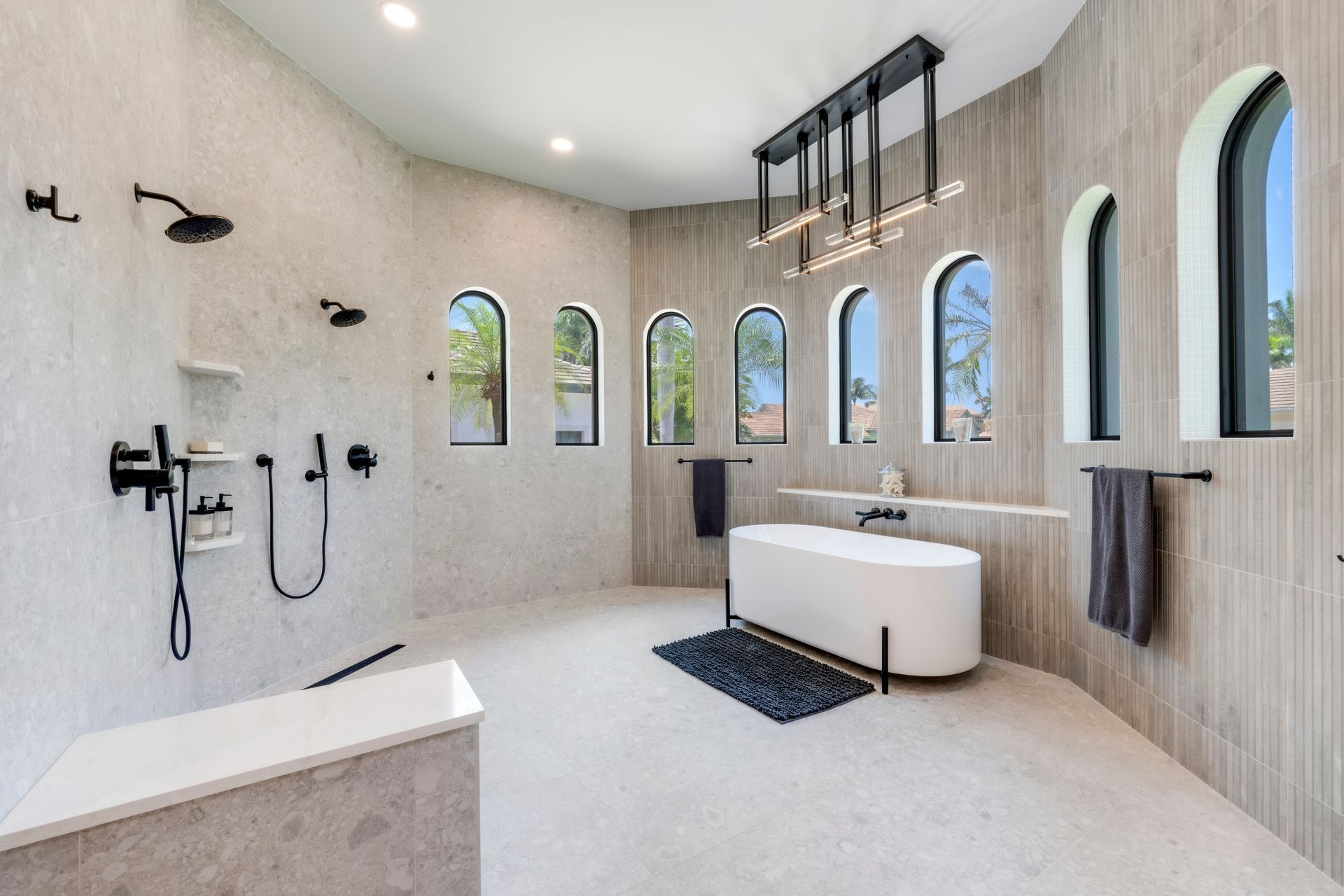 A bathroom with two mirrors and a sink.