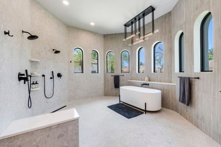 A bathroom with two mirrors and a sink.