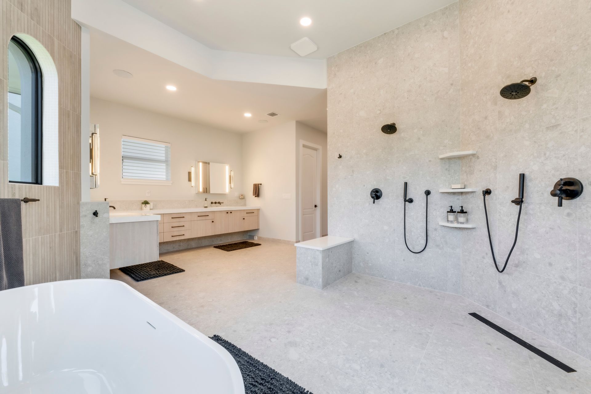 A bathroom with a bathtub and a shower.