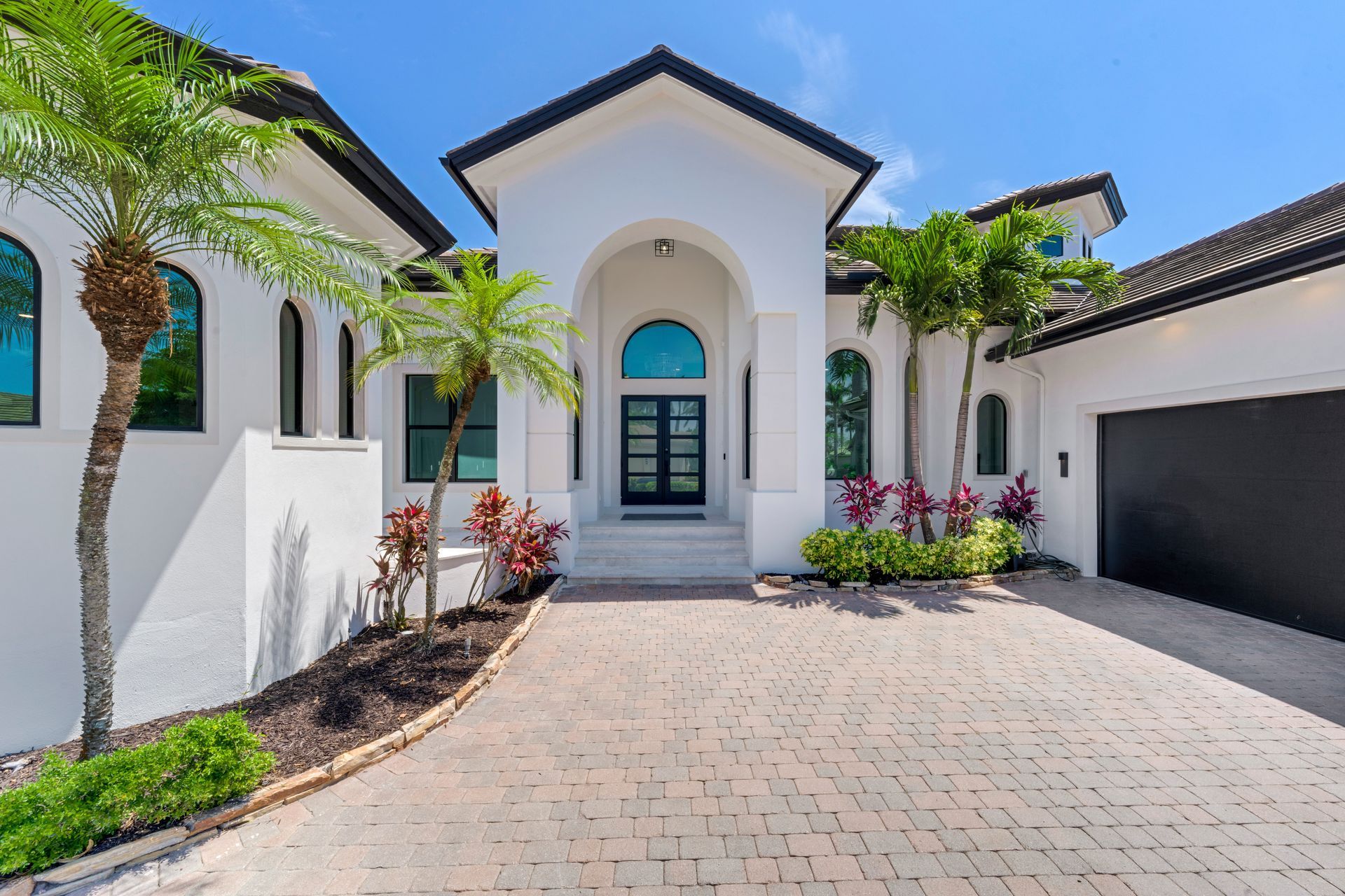 A bathroom with a tub , sink , and shower.
