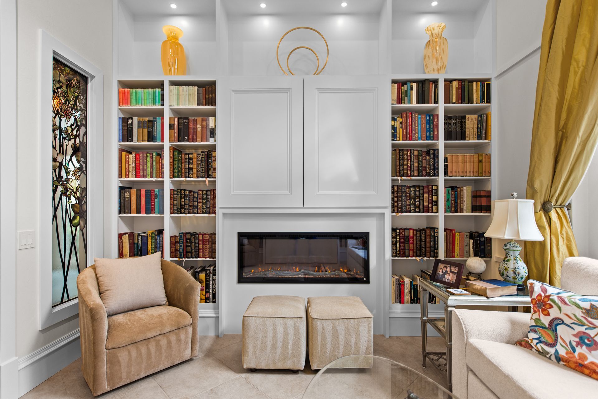 A kitchen with blue cabinets and white counter tops.