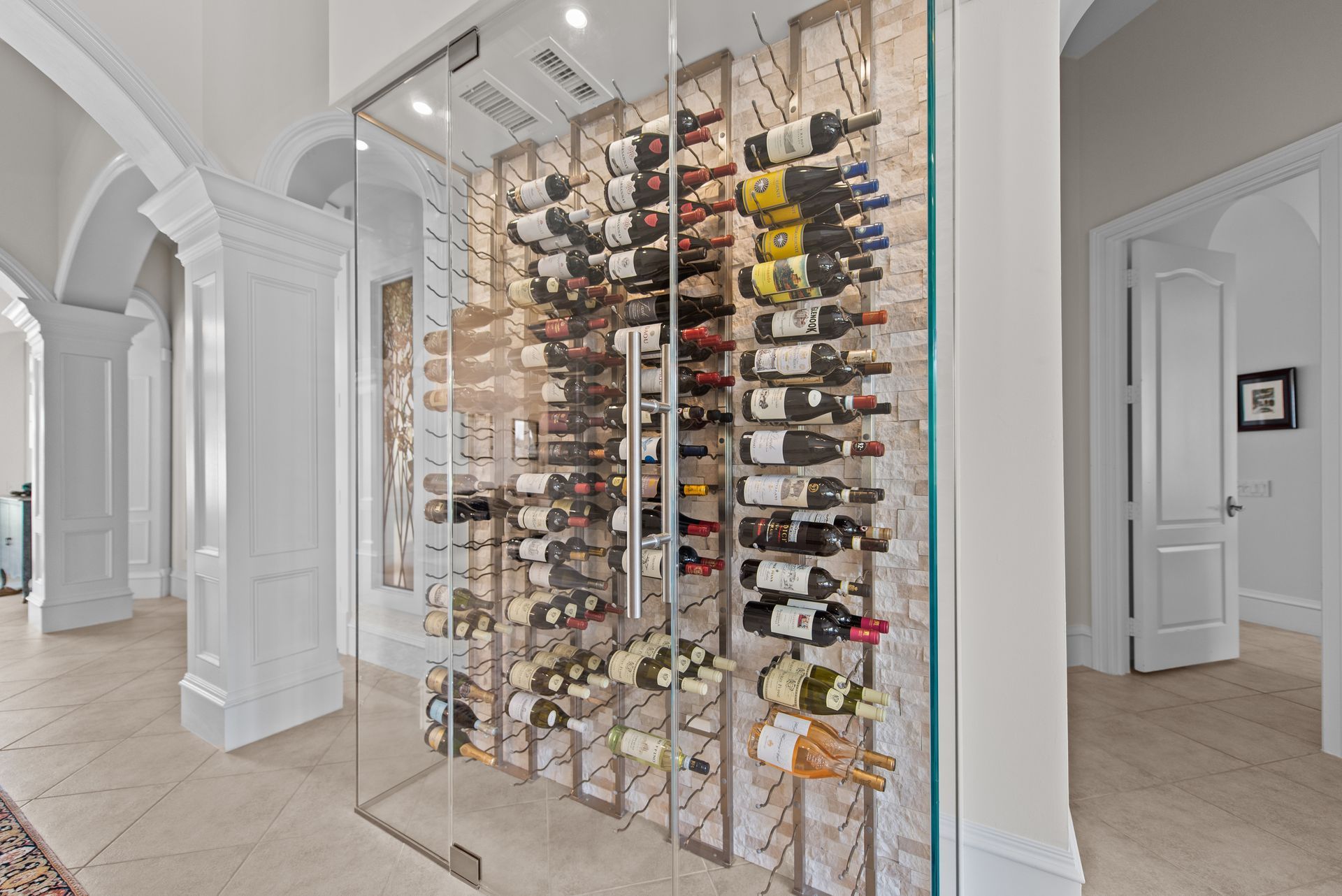 A wine cellar filled with lots of bottles of wine.
