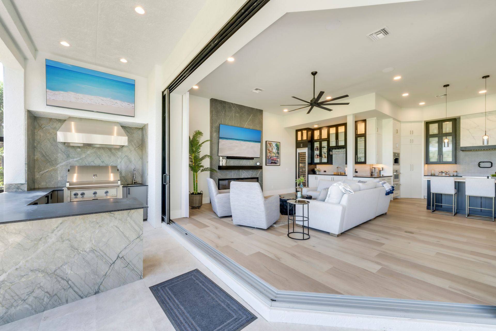 A living room with a couch , chairs , and a grill.