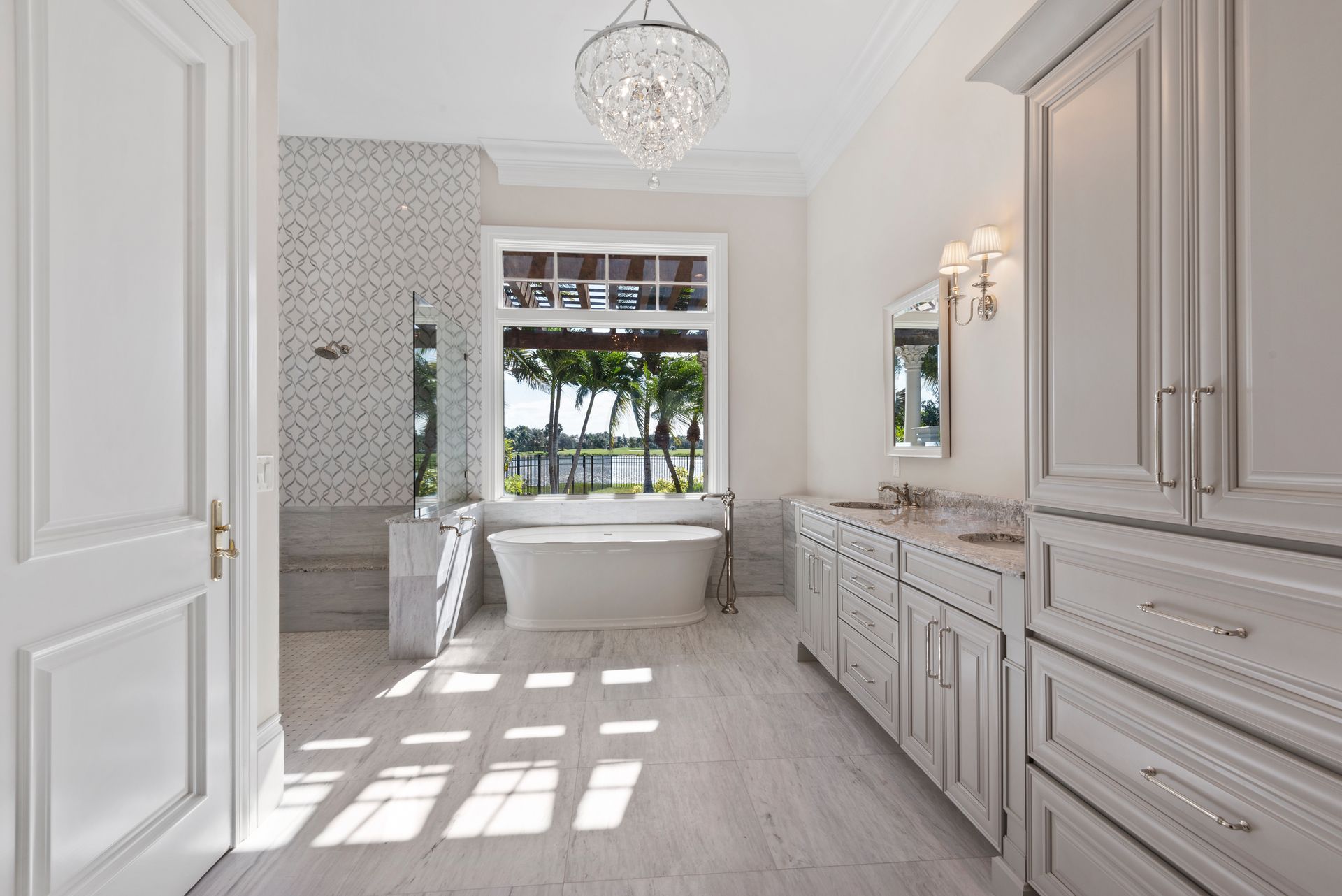 A bathroom with a bathtub and a large window