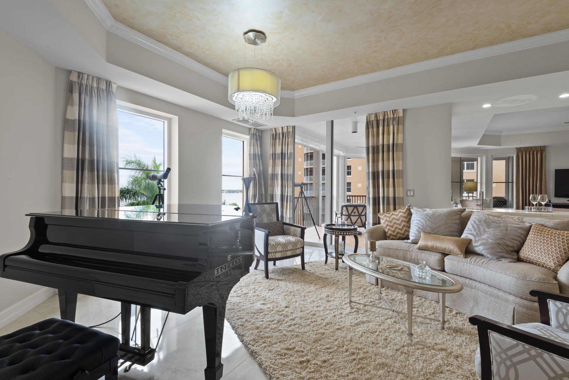 There is a piano in the middle of the living room.