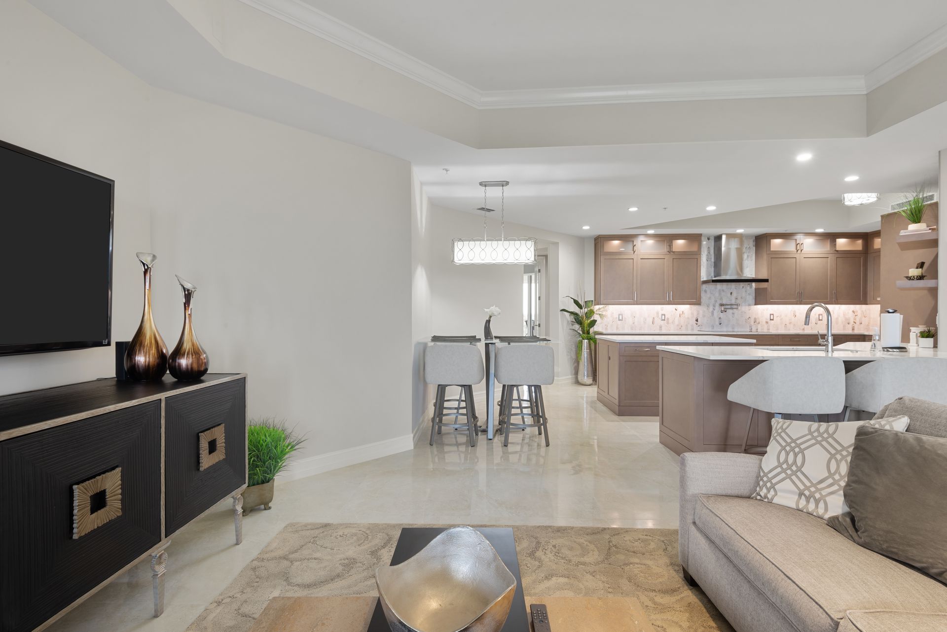 A living room with a couch and a flat screen tv.