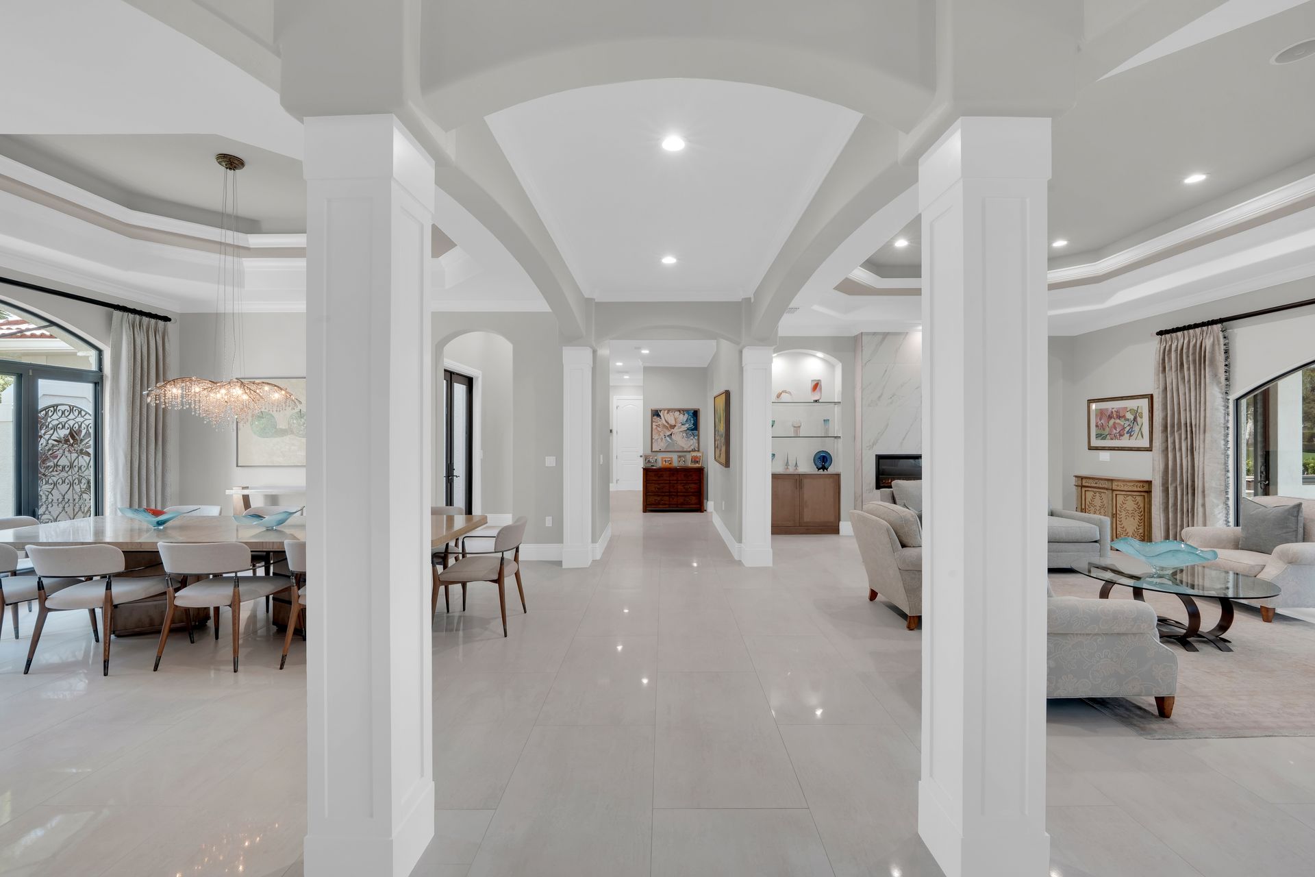 A living room filled with furniture and a ceiling fan.