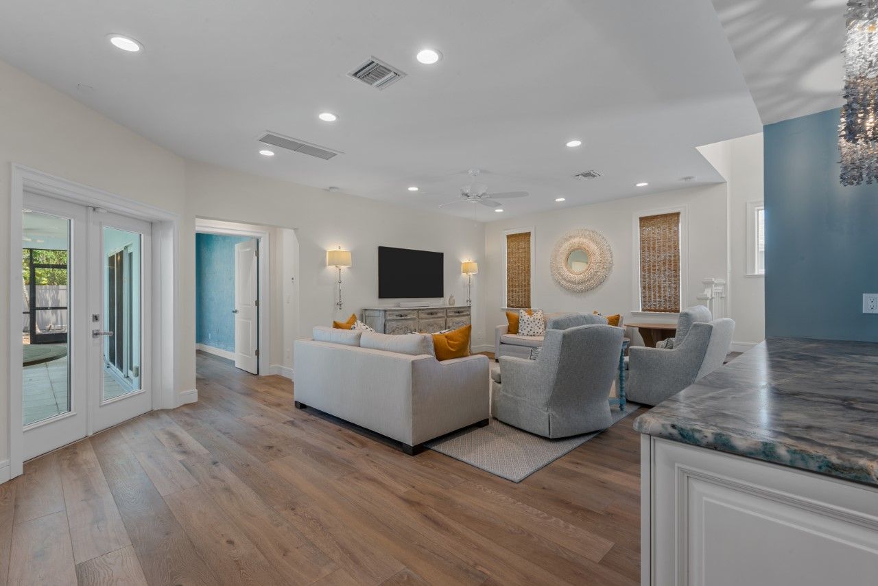 A living room filled with furniture and a flat screen tv.