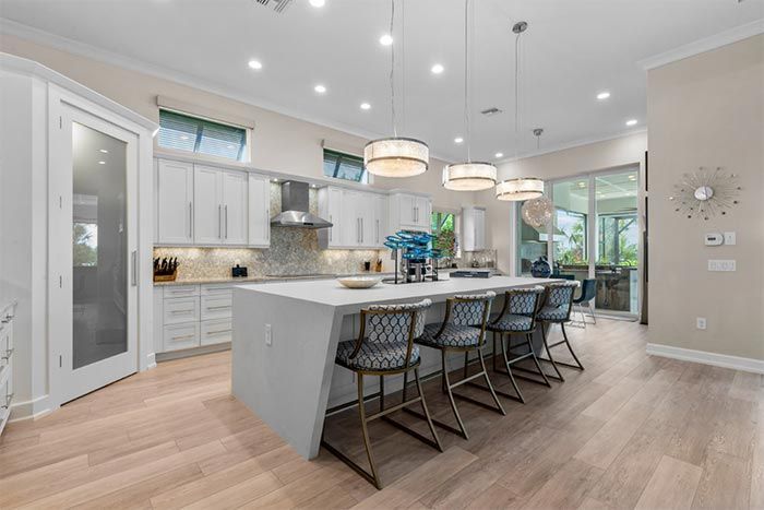 There is a large island in the middle of the kitchen.