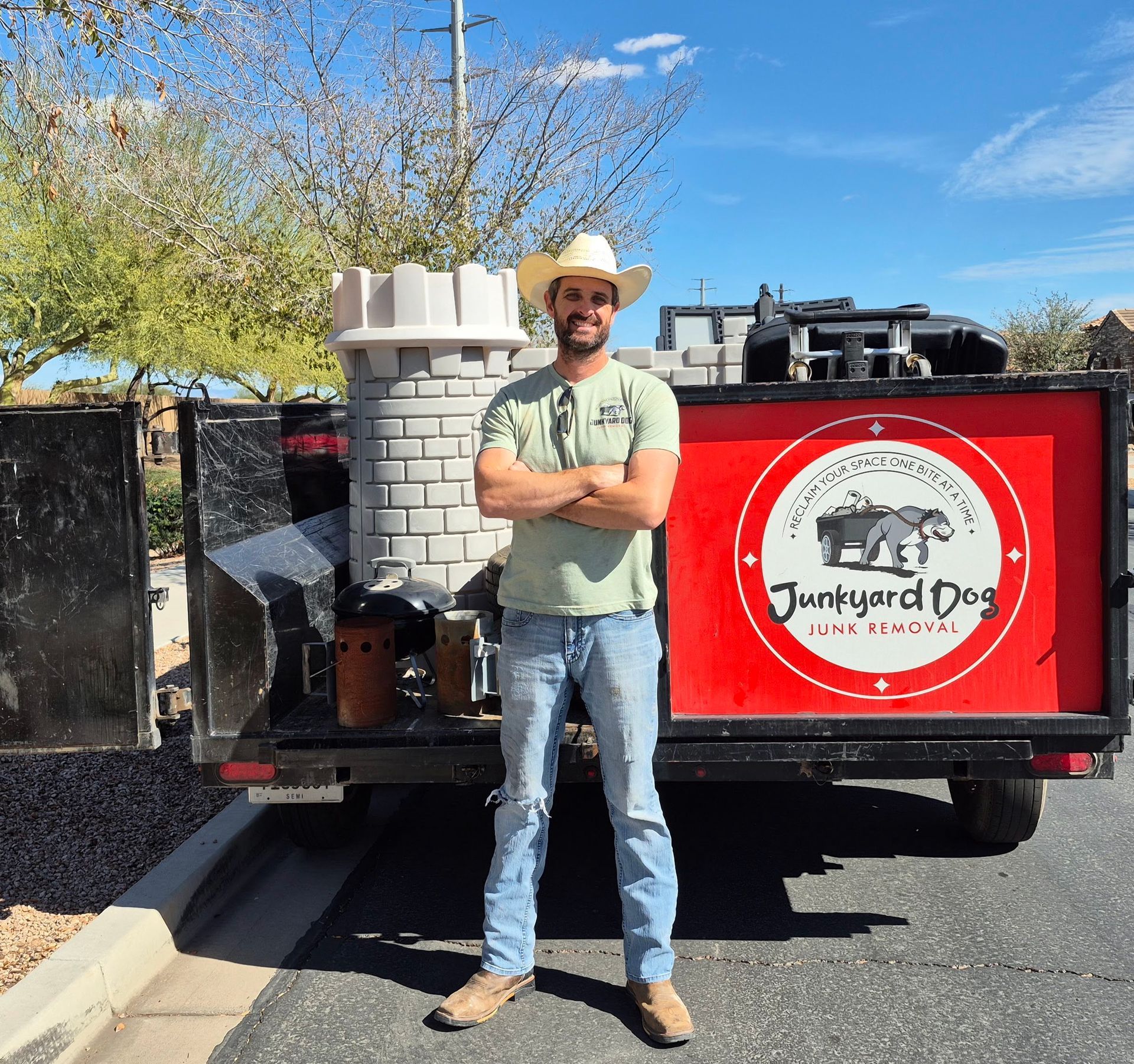 A pile of bricks is sitting next to a bulldozer on a construction site.