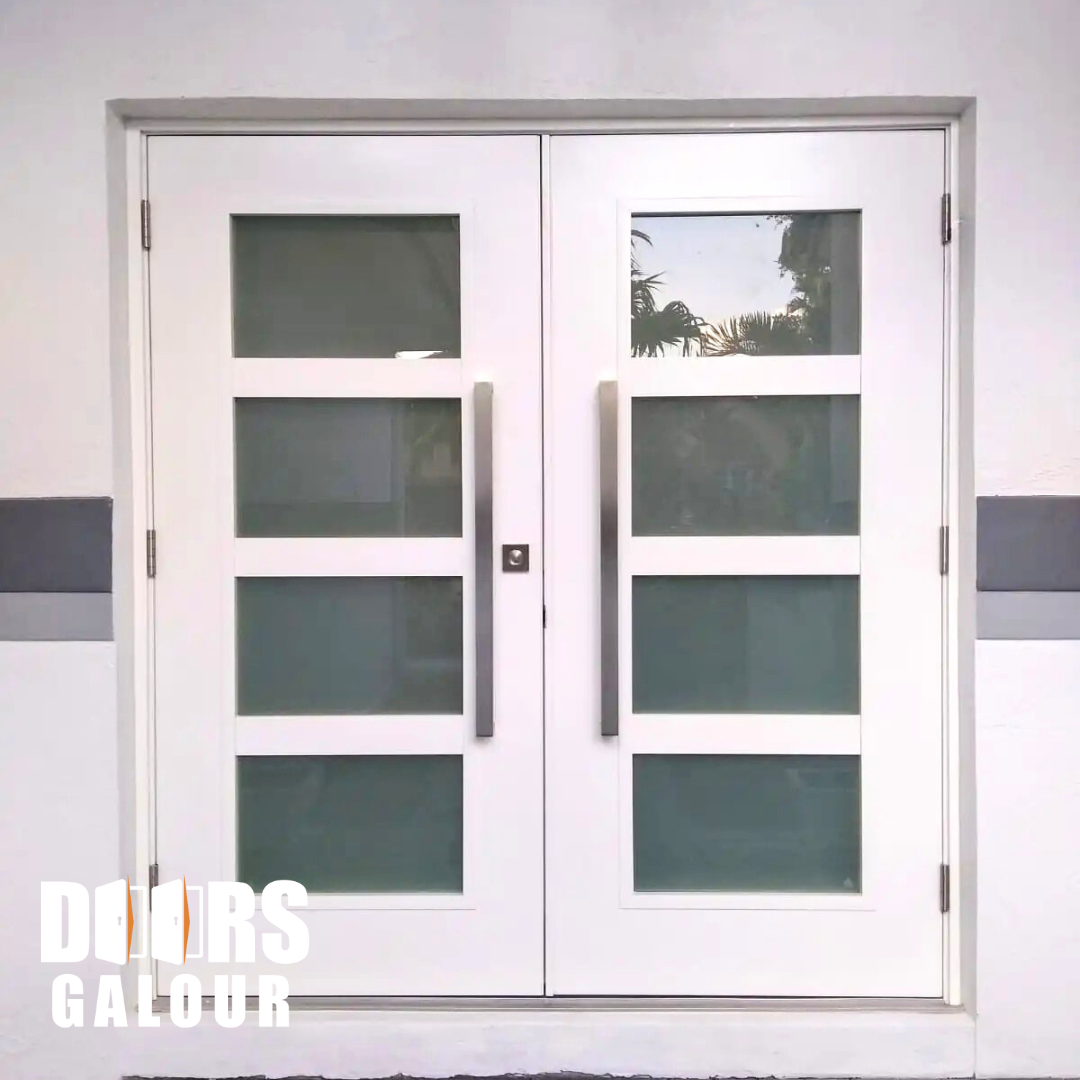 White double doors with frosted glass panes and silver handles, set in a white wall.