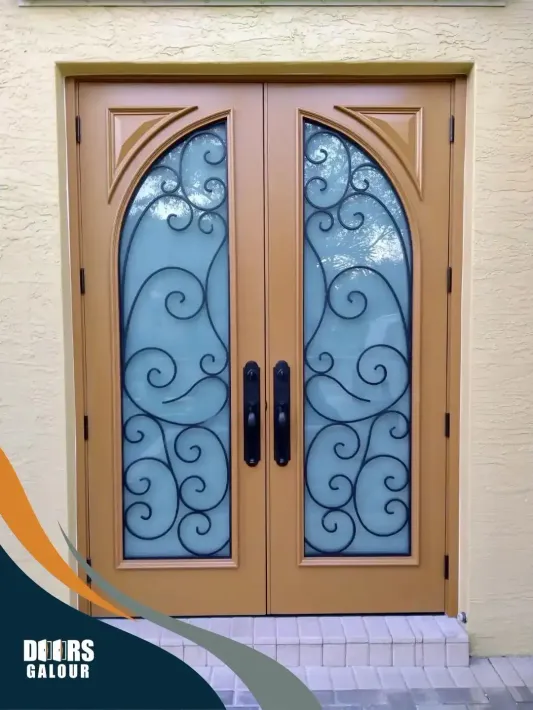 A double door with a wrought iron design on it