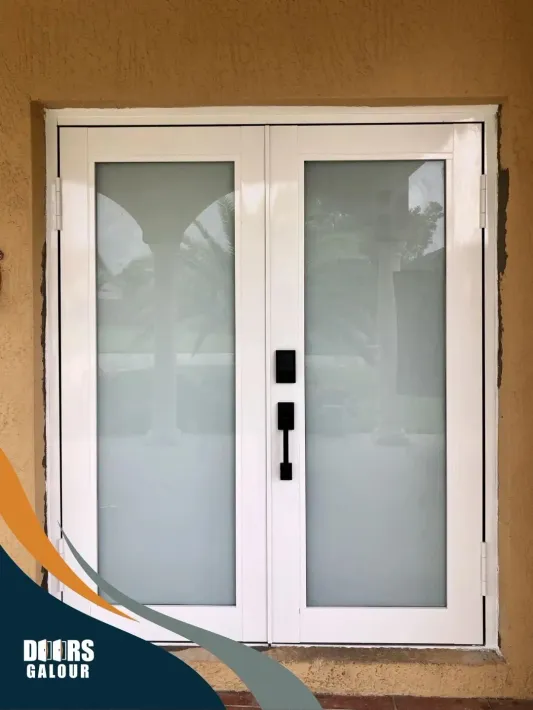 A white door with a black handle is on a brown wall