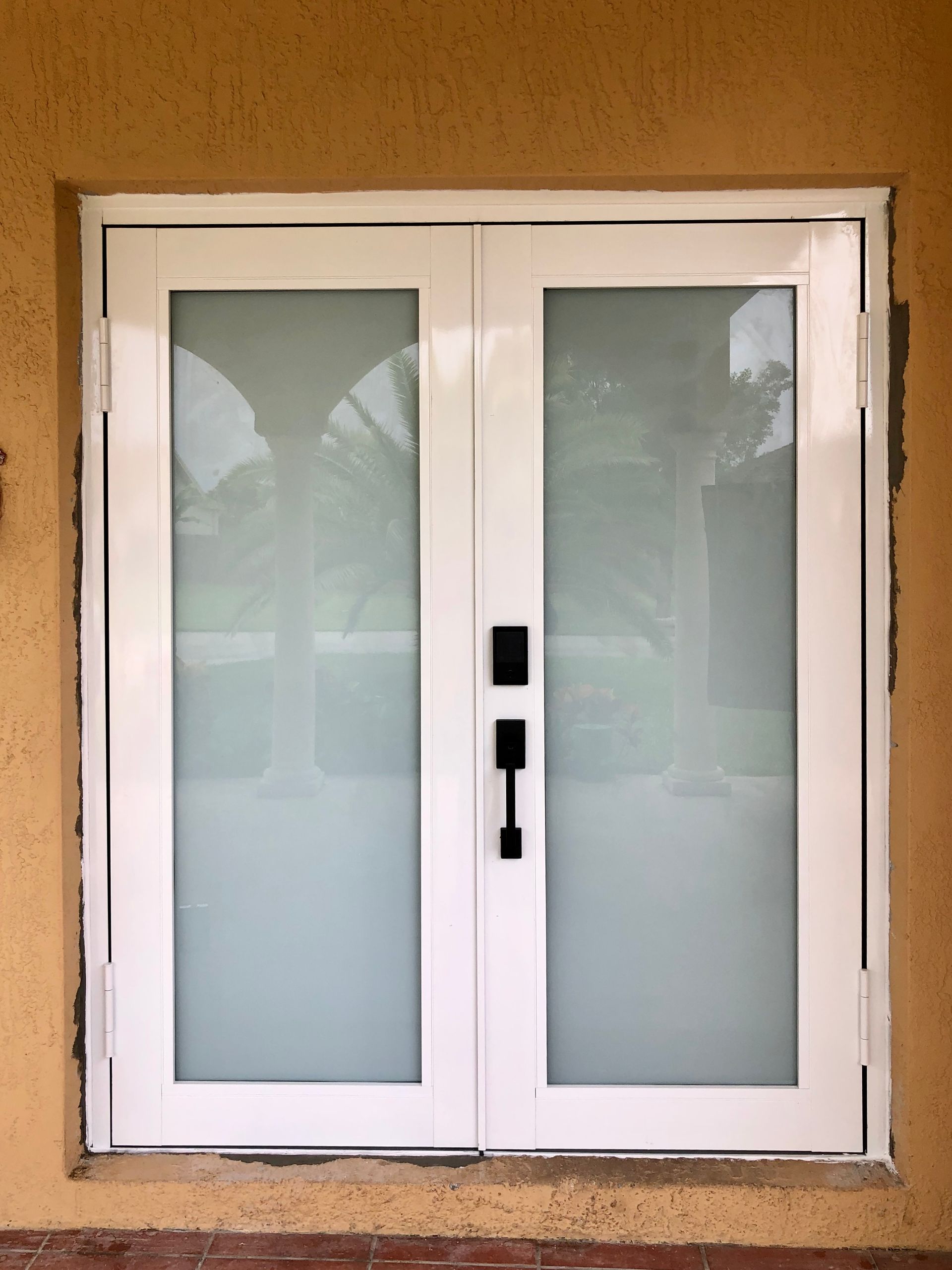 A double white aluminum door in South Florida