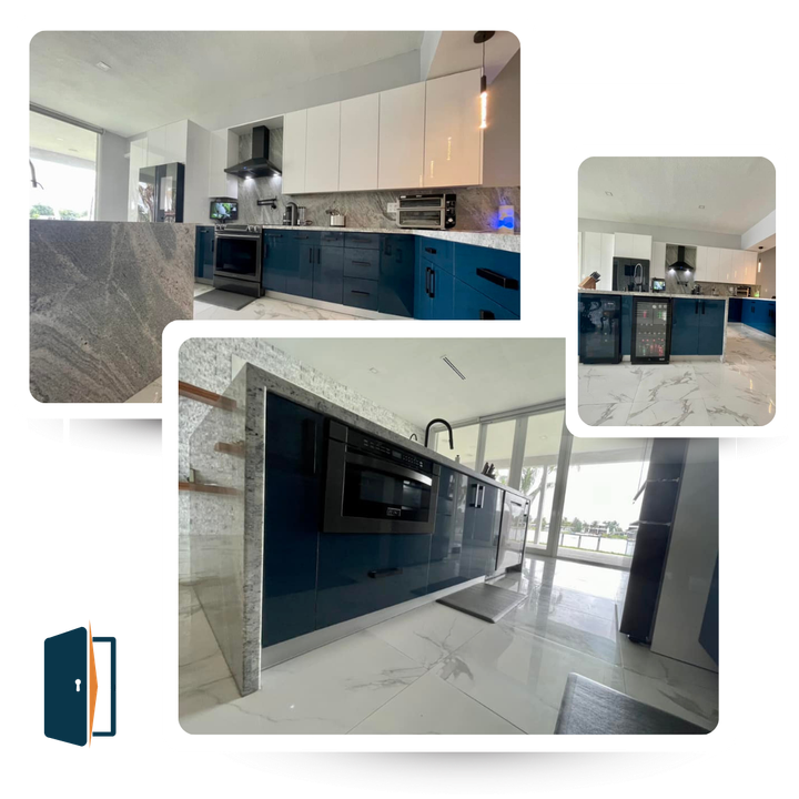 Modern kitchen with white and blue cabinets, stainless steel appliances, and island.