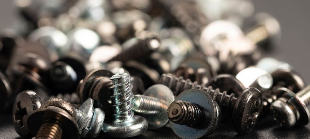 A Pile Of Screws And Nuts On A Table. — Illawarra Fasteners Pty Ltd In Unanderra, NSW