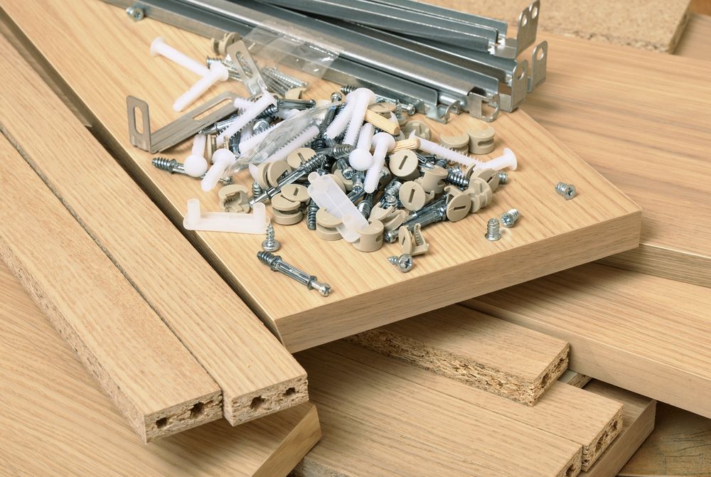 A Pile Of Wood With Screws And Nails On It — Illawarra Fasteners Pty Ltd In Unanderra, NSW