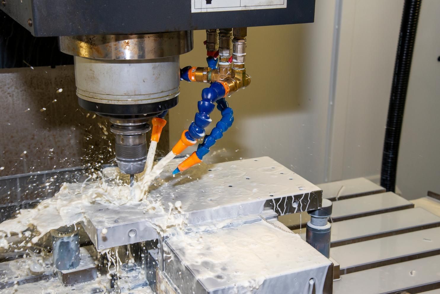 Cutting Fluid Being Used On A Machine To Cut A Piece Of Metal — Illawarra Fasteners Pty Ltd In Unanderra, NSW