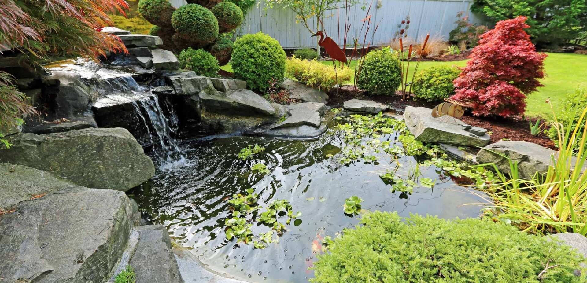 How to Implement Waterfall Features Into Your Backyard Pond