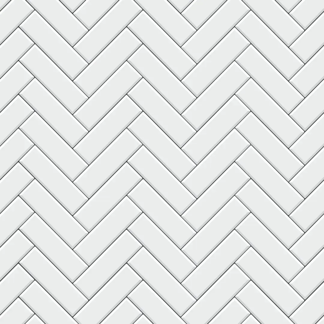 A seamless pattern of white subway tiles in a herringbone pattern.