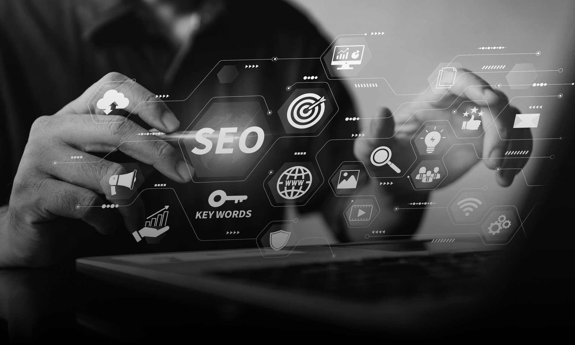 Person using a laptop, interacting with a holographic display of SEO-related icons.